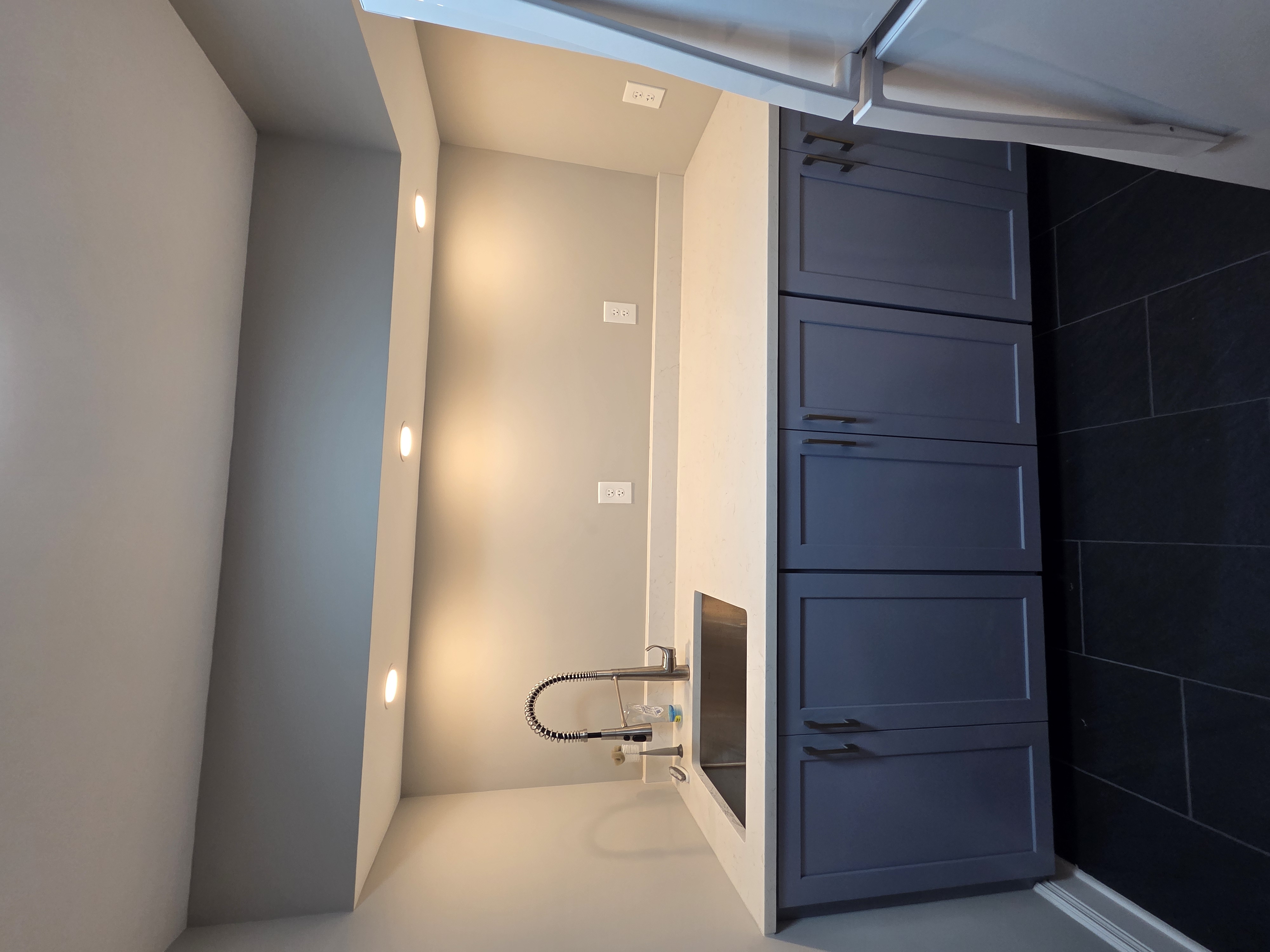 Laundry room with stacked washer/dryer