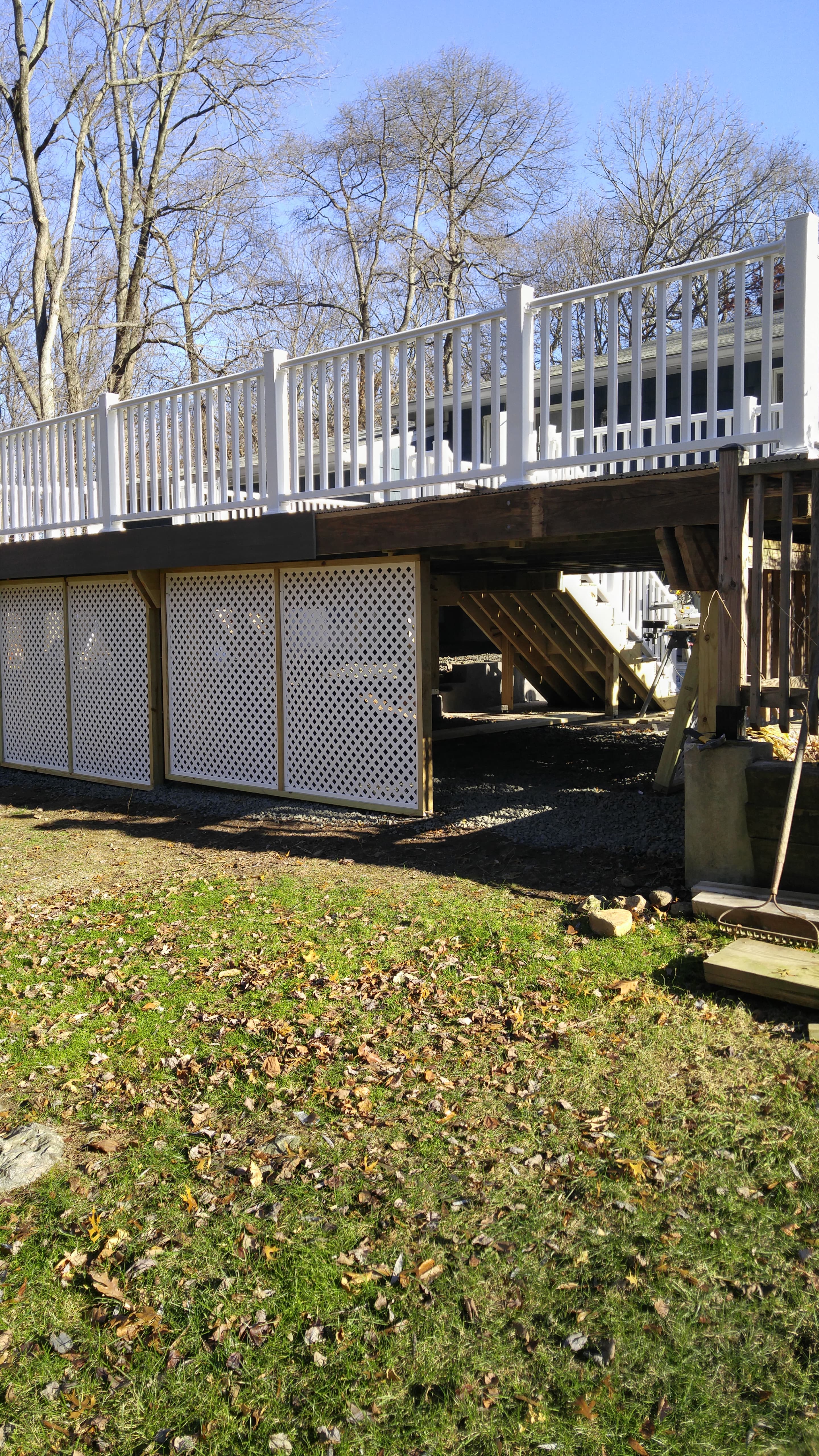 Deck with white railings and stairs