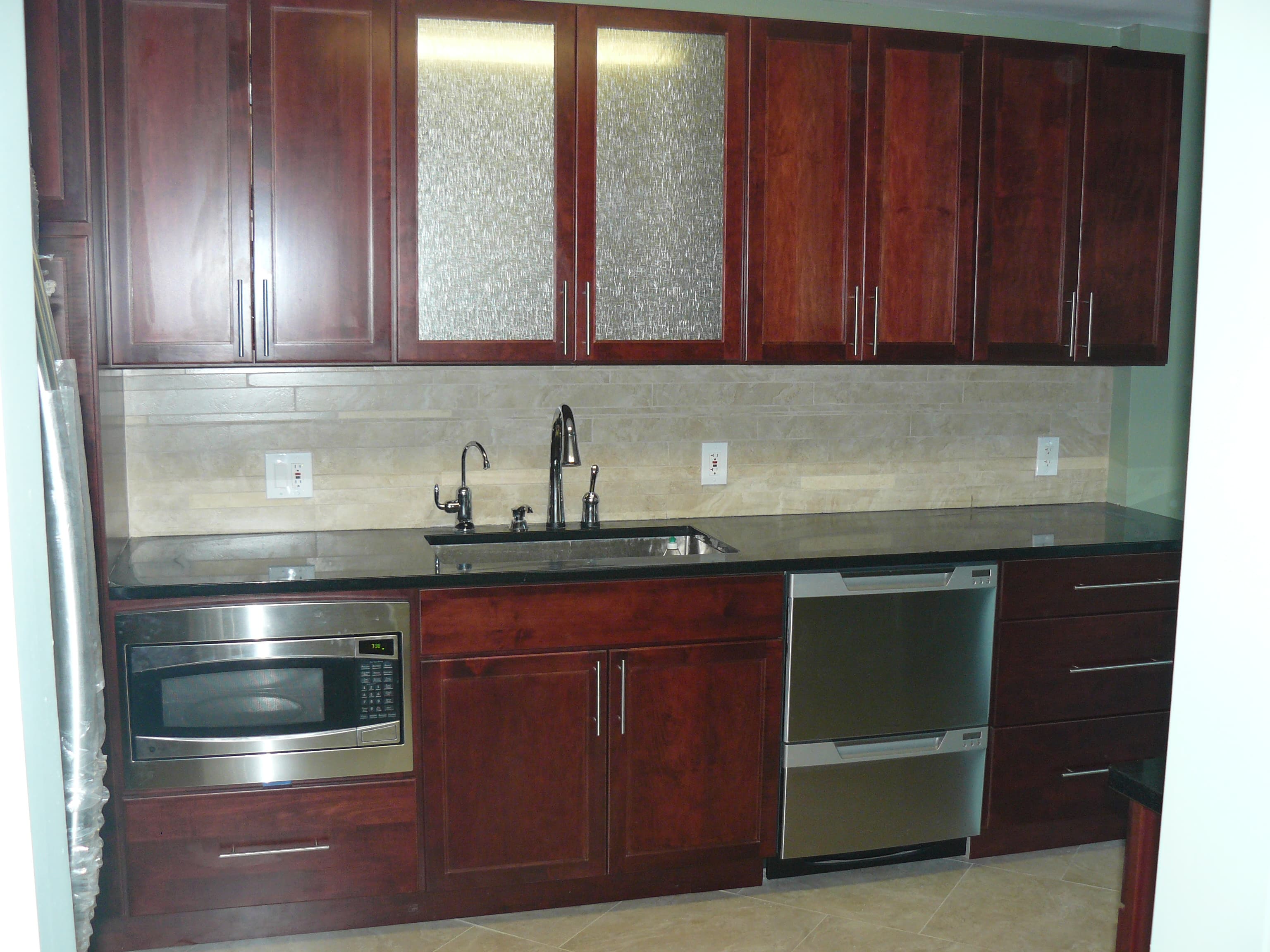 Wet bar with glass-front cabinets