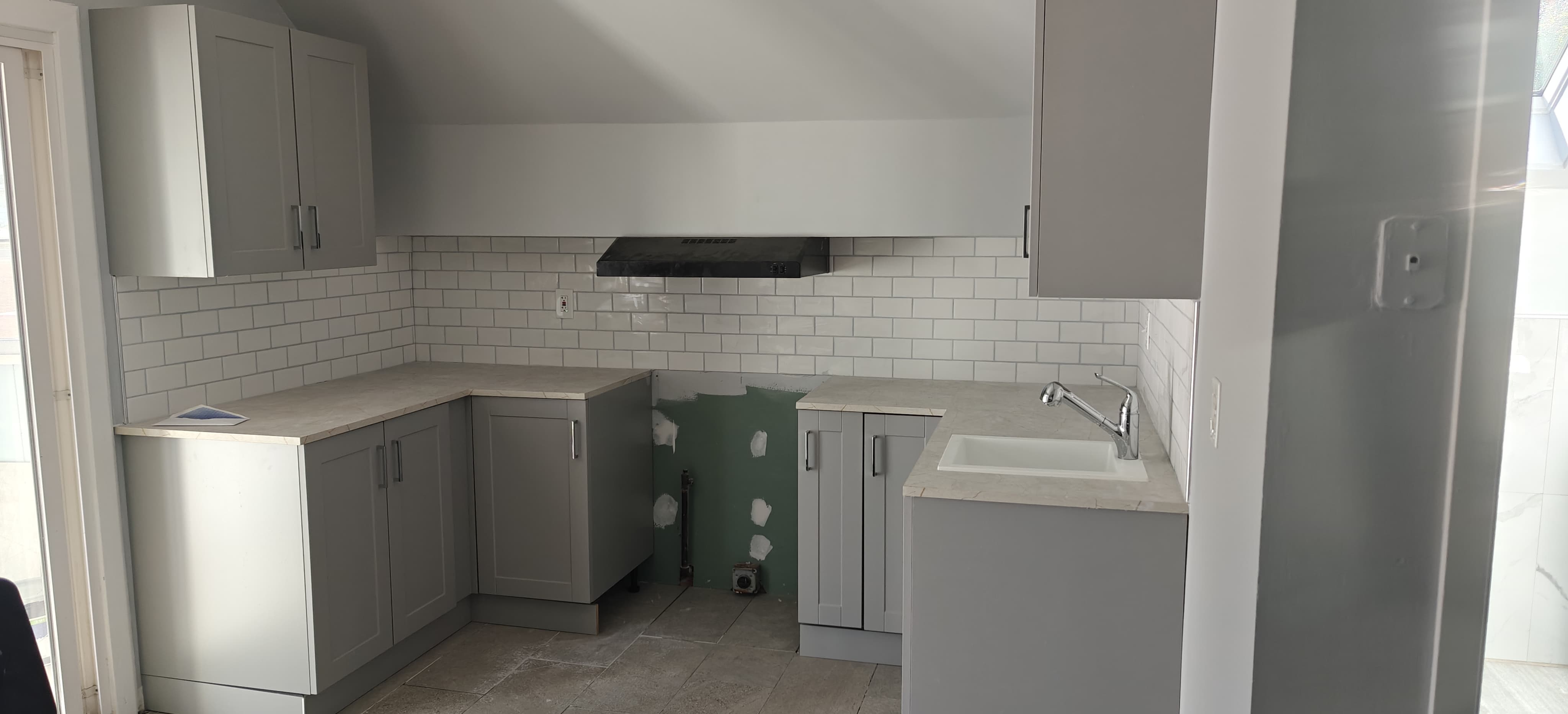 Modern kitchen remodel with white subway tile