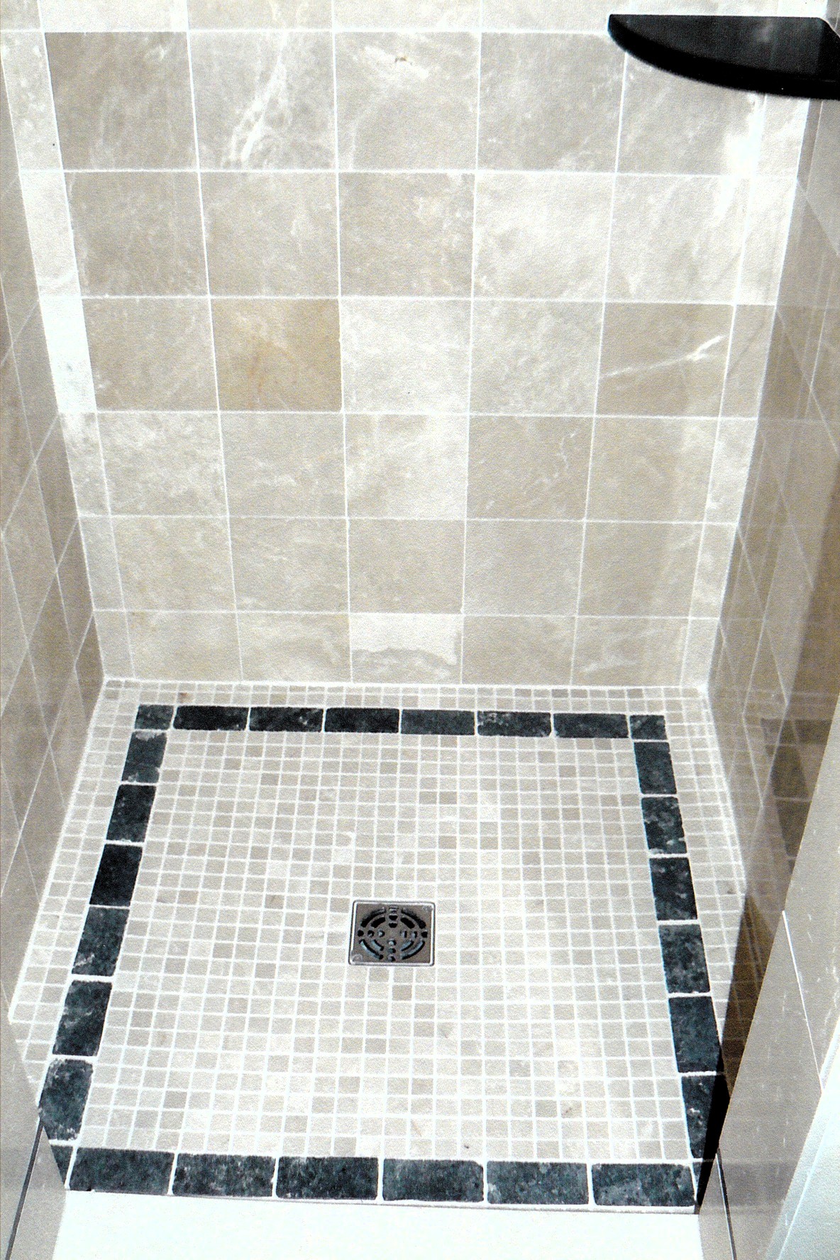 Luxury shower with mosaic tile accents
