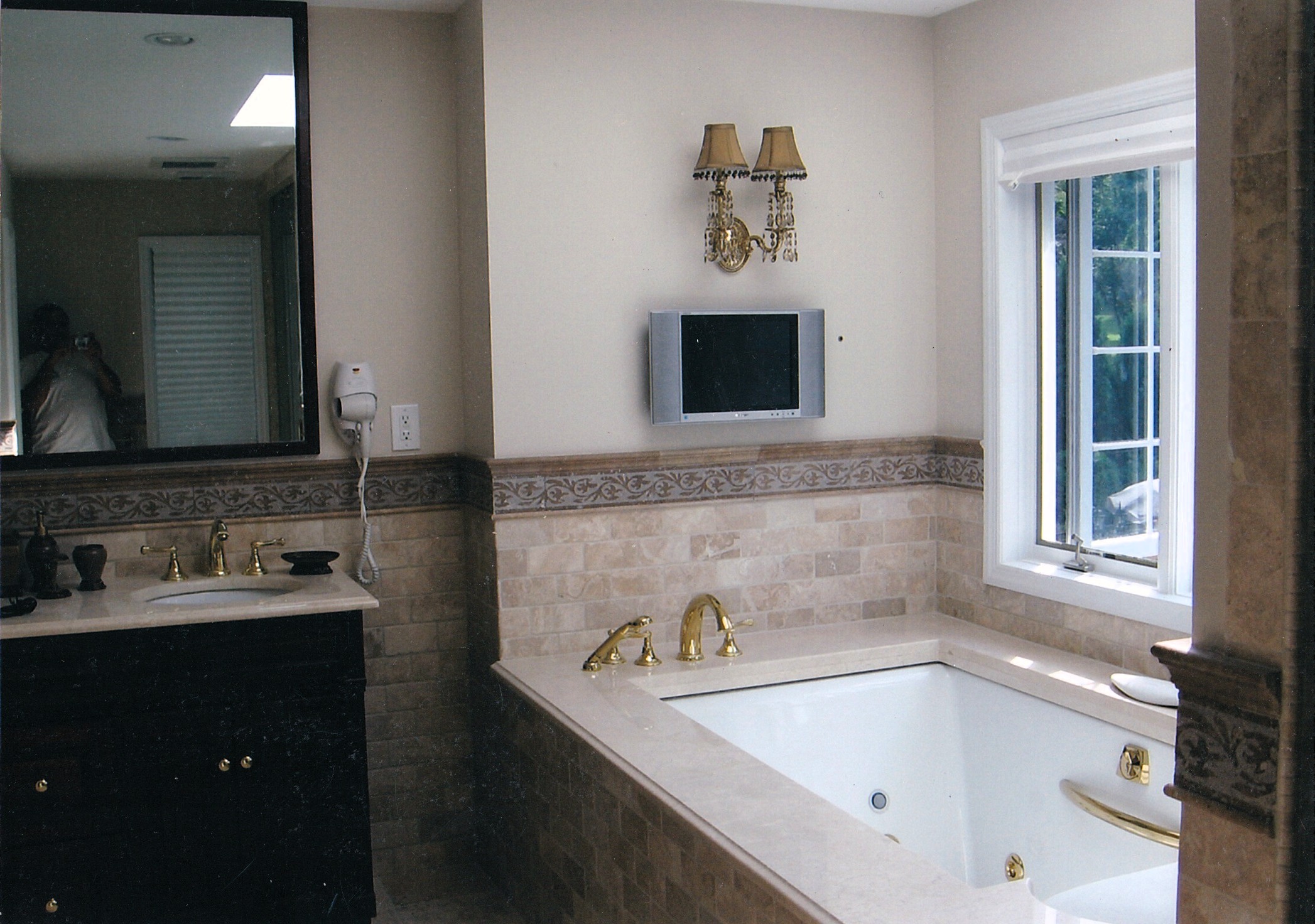 Bathroom with skylight and custom tile