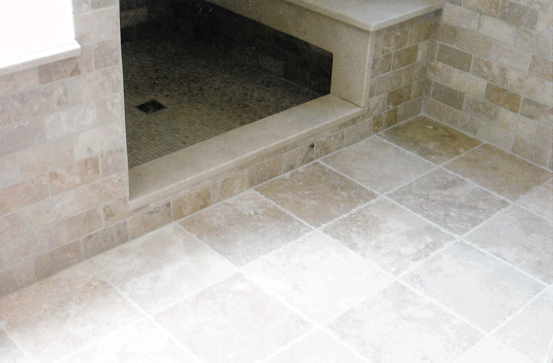 Walk-in shower with diagonal tile pattern